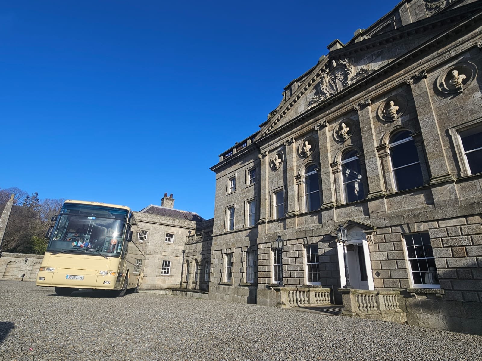 Paynes luxury coach parked at a grand Irish manor house