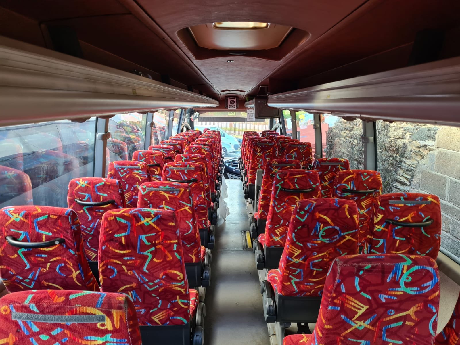 Interior of the Syste coach with red seats